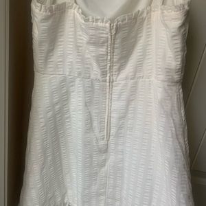 A white quilt like dress